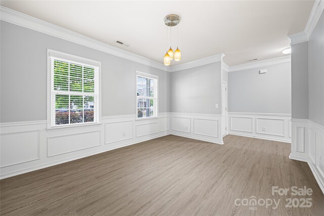 8400 Empress Ct, Charlotte, NC 28227 - empty room featuring wainscoting, crown molding, and wood finished floors