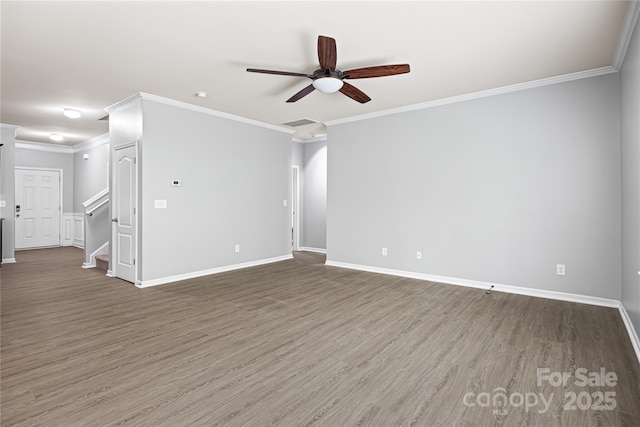 8400 Empress Ct, Charlotte, NC 28227 - empty room with ceiling fan, wood finished floors, baseboards, ornamental molding, and stairs
