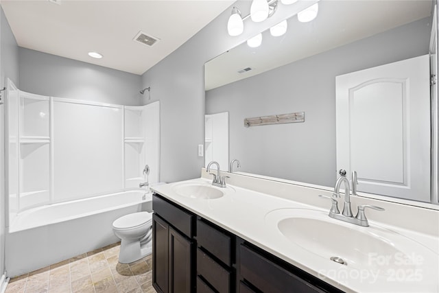8400 Empress Ct, Charlotte, NC 28227 - bathroom with double vanity, toilet, stone finish flooring, and bathing tub / shower combination