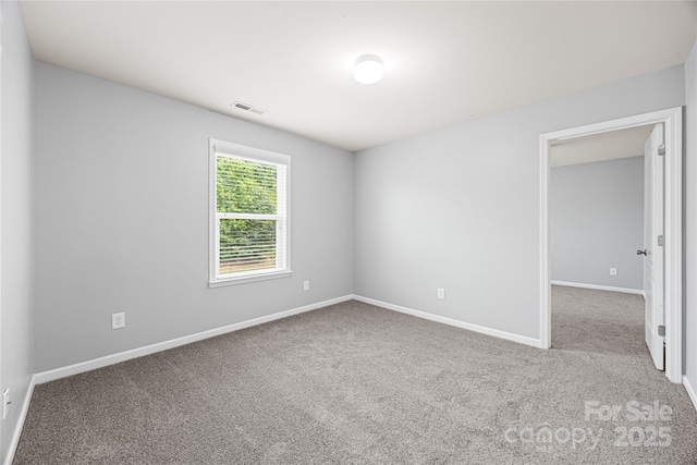 8400 Empress Ct, Charlotte, NC 28227 - carpeted empty room with baseboards