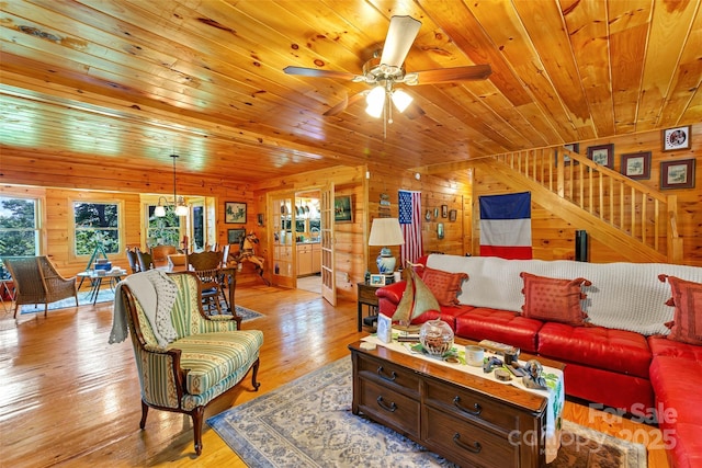 252 Idylwild Ln, Black Mountain, NC 28711 - living area with wooden walls, wood ceiling, light wood-type flooring, ceiling fan, and stairway