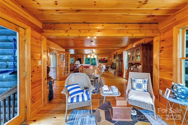 252 Idylwild Ln, Black Mountain, NC 28711 - dining room with wood walls, hardwood / wood-style flooring, wood ceiling, and a chandelier