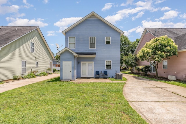 1825 Stroud Park Ct, Charlotte, NC 28206 - rear view of house featuring a lawn and central AC unit