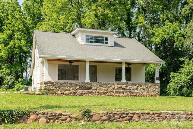 540 Fairview Rd, Asheville, NC 28803 - view of front of property with ceiling fan, a front yard, a shingled roof, and stone siding