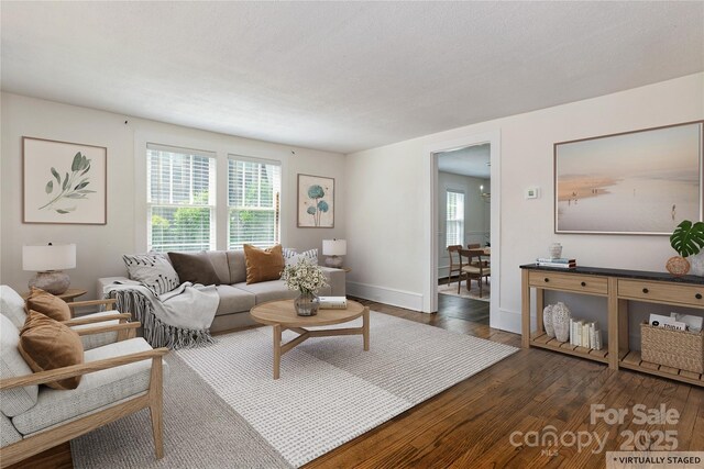 540 Fairview Rd, Asheville, NC 28803 - living area with plenty of natural light, dark wood-style floors, and baseboards