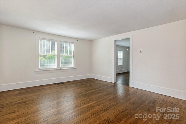 540 Fairview Rd, Asheville, NC 28803 - empty room with dark wood-style flooring and baseboards