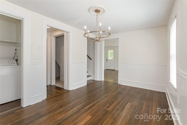 540 Fairview Rd, Asheville, NC 28803 - unfurnished dining area with washer / clothes dryer, a wainscoted wall, dark wood finished floors, a chandelier, and stairway