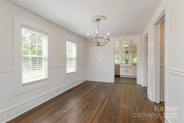 540 Fairview Rd, Asheville, NC 28803 - unfurnished dining area with a chandelier, a sink, a wainscoted wall, and dark wood-style flooring