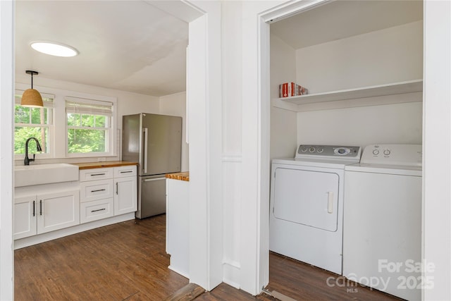 540 Fairview Rd, Asheville, NC 28803 - laundry area with separate washer and dryer and dark wood-style flooring