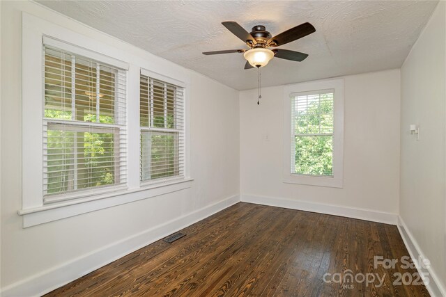 540 Fairview Rd, Asheville, NC 28803 - empty room with dark wood-style floors, baseboards, ceiling fan, and a textured ceiling