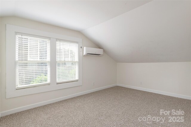 540 Fairview Rd, Asheville, NC 28803 - bonus room featuring an AC wall unit, vaulted ceiling, baseboards, and carpet flooring