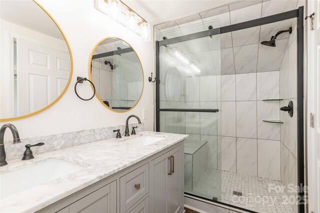 540 Fairview Rd, Asheville, NC 28803 - bathroom featuring a stall shower and double vanity