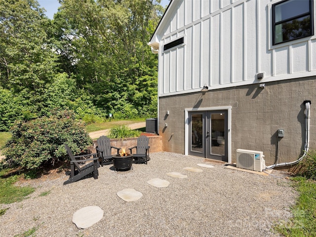 31 Rory Phillips Vw, Candler, NC 28715 - back of property with board and batten siding, a fire pit, ac unit, french doors, and a patio