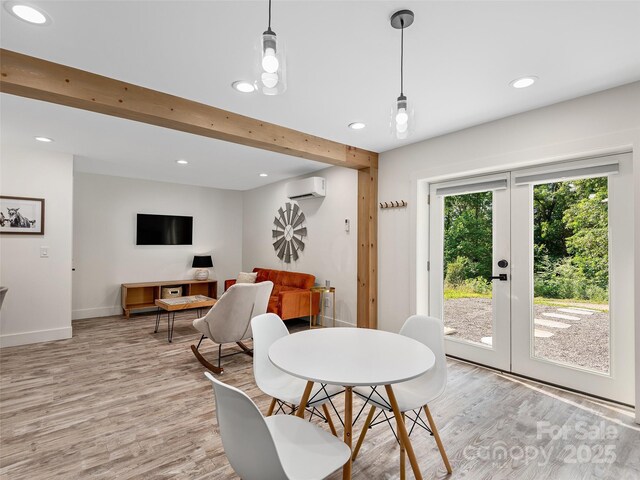 31 Rory Phillips Vw, Candler, NC 28715 - dining space featuring a wall mounted air conditioner, french doors, light wood-style flooring, recessed lighting, and baseboards