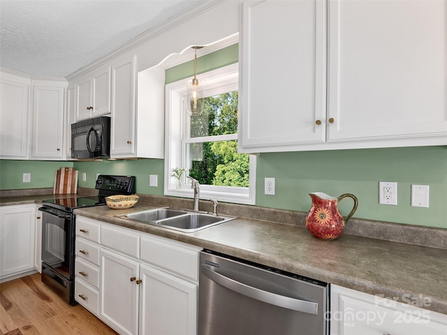 31 Rory Phillips Vw, Candler, NC 28715 - kitchen featuring black appliances, a sink, white cabinets, light wood-style flooring, and a textured ceiling