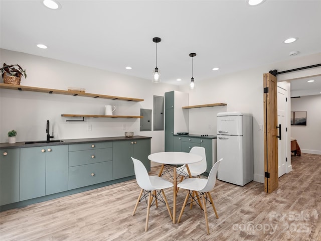 31 Rory Phillips Vw, Candler, NC 28715 - dining space featuring a barn door, light wood-type flooring, electric panel, recessed lighting, and baseboards