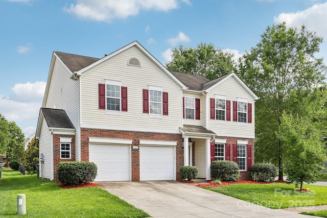5002 Abode Lily Ln, Charlotte, NC 28227 - view of front of home with brick siding, driveway, a garage, and a front yard