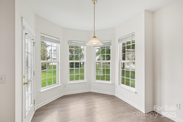 5002 Abode Lily Ln, Charlotte, NC 28227 - unfurnished dining area with wood finished floors and baseboards