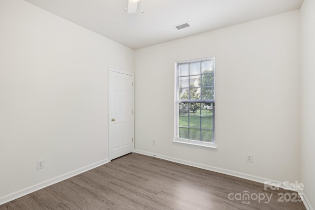 5002 Abode Lily Ln, Charlotte, NC 28227 - spare room with wood finished floors and a ceiling fan