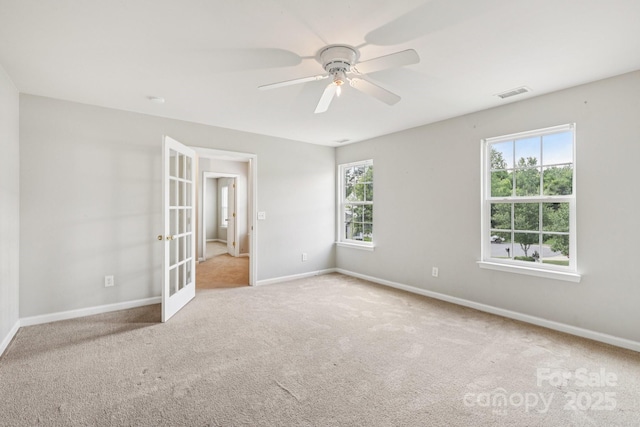 5002 Abode Lily Ln, Charlotte, NC 28227 - unfurnished room with carpet flooring, french doors, and a ceiling fan