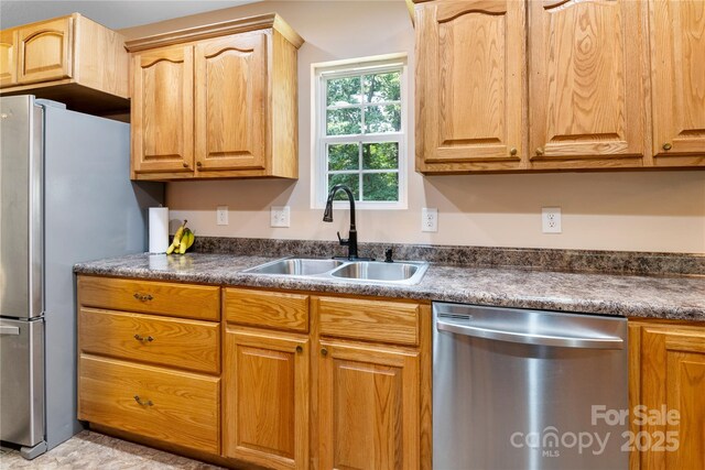 251 Vera Ln, Columbus, NC 28722 - kitchen with stainless steel appliances, a sink, and dark countertops