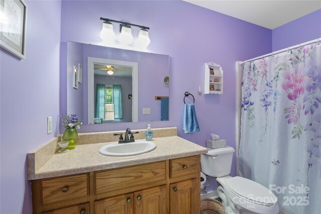 251 Vera Ln, Columbus, NC 28722 - full bath with toilet, vanity, a ceiling fan, and curtained shower