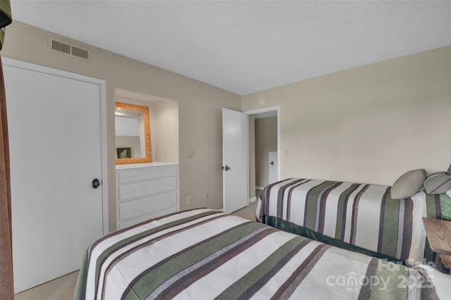 55 Toxaway Shrs Unit 14, Lake Toxaway, NC 28747 - bedroom featuring carpet flooring and a textured ceiling