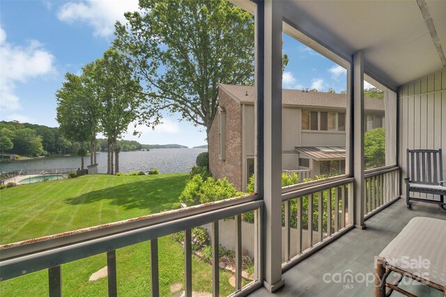 55 Toxaway Shrs Unit 14, Lake Toxaway, NC 28747 - sunroom featuring a water view and lofted ceiling
