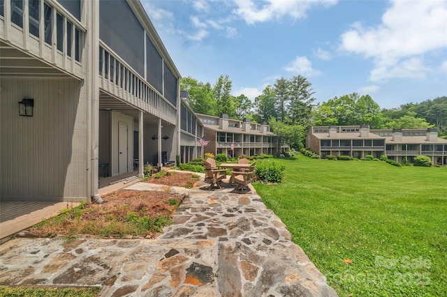 55 Toxaway Shrs Unit 14, Lake Toxaway, NC 28747 - view of green lawn with a patio