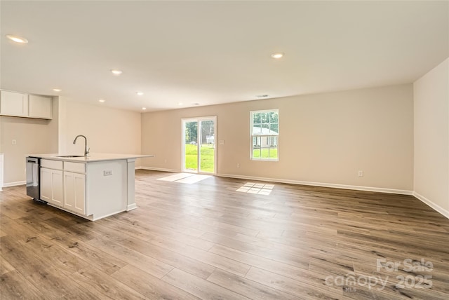 2118 Columbidae Ln, Gastonia, NC 28052 - kitchen with dishwasher, white cabinetry, open floor plan, light wood finished floors, and recessed lighting