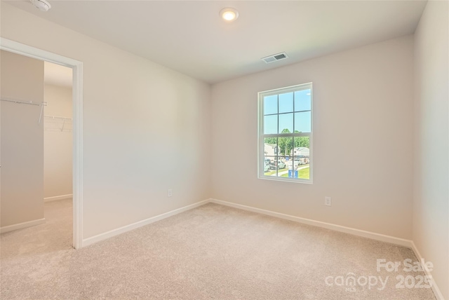 2118 Columbidae Ln, Gastonia, NC 28052 - unfurnished bedroom with light colored carpet, a spacious closet, a closet, and recessed lighting