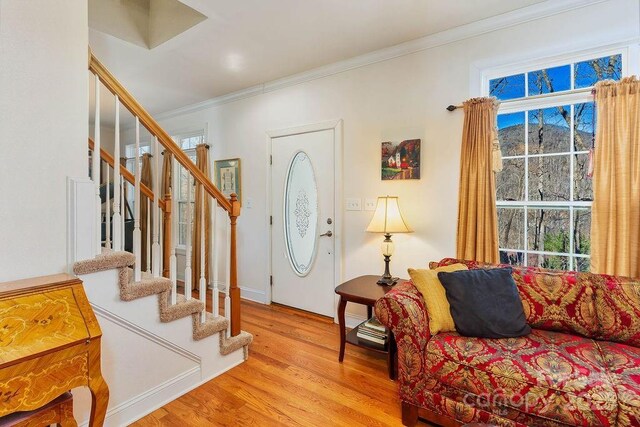 387 Goodview Dr, Hendersonville, NC 28792 - foyer featuring stairway, wood finished floors, and crown molding