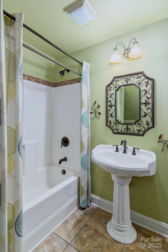 387 Goodview Dr, Hendersonville, NC 28792 - full bathroom featuring shower / bath combo with shower curtain and tile patterned floors