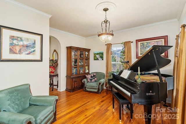 387 Goodview Dr, Hendersonville, NC 28792 - living area featuring arched walkways, light wood finished floors, and ornamental molding