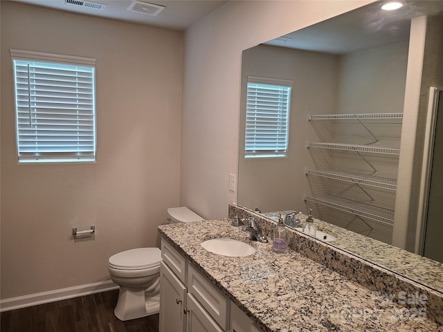 1195 Winding Creek Rd, Salisbury, NC 28146 - bathroom featuring toilet, wood finished floors, baseboards, and vanity
