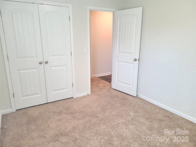 1195 Winding Creek Rd, Salisbury, NC 28146 - unfurnished bedroom with carpet flooring, baseboards, and a closet