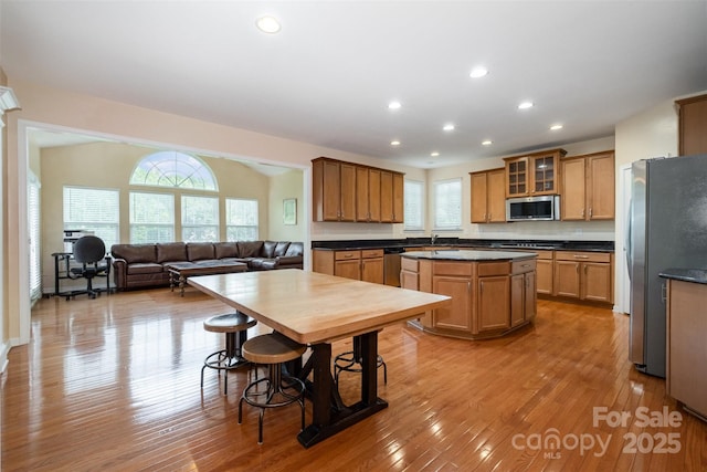 4201 Amber Leigh Way Dr, Charlotte, NC 28269 - kitchen featuring stainless steel appliances, dark countertops, a center island, healthy amount of natural light, and recessed lighting