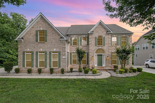 4201 Amber Leigh Way Dr, Charlotte, NC 28269 - georgian-style home featuring brick siding, a lawn, and roof with shingles