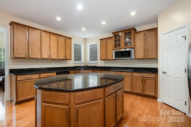 4201 Amber Leigh Way Dr, Charlotte, NC 28269 - kitchen with stainless steel appliances, light wood-type flooring, brown cabinetry, and recessed lighting
