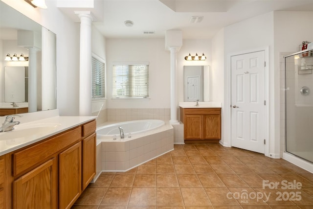 4201 Amber Leigh Way Dr, Charlotte, NC 28269 - bathroom featuring two vanities, a garden tub, tile patterned floors, and a stall shower