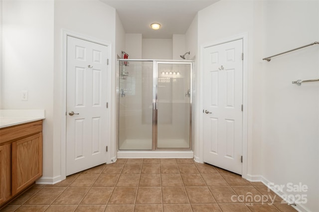 4201 Amber Leigh Way Dr, Charlotte, NC 28269 - bathroom with tile patterned floors, a shower stall, and vanity