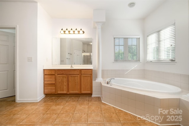 4201 Amber Leigh Way Dr, Charlotte, NC 28269 - bathroom with vanity, a bath, tile patterned flooring, and decorative columns