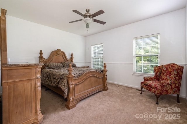 4201 Amber Leigh Way Dr, Charlotte, NC 28269 - bedroom featuring multiple windows, light colored carpet, and ceiling fan