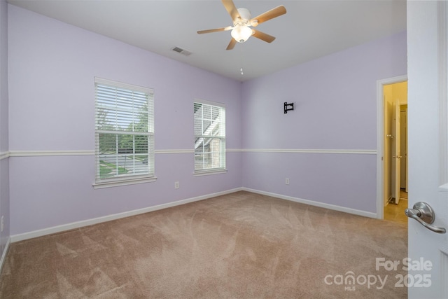 4201 Amber Leigh Way Dr, Charlotte, NC 28269 - spare room featuring plenty of natural light, carpet flooring, and a ceiling fan