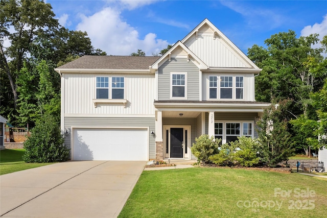3212 Gilroy Dr, Fort Mill, SC 29707 - view of front of home with board and batten siding, an attached garage, a front yard, and concrete driveway