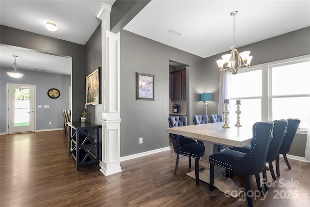 3212 Gilroy Dr, Fort Mill, SC 29707 - dining room featuring decorative columns, dark wood-style flooring, and a chandelier