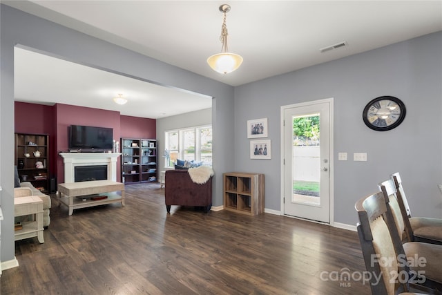 3212 Gilroy Dr, Fort Mill, SC 29707 - living area with wood finished floors, plenty of natural light, and a fireplace