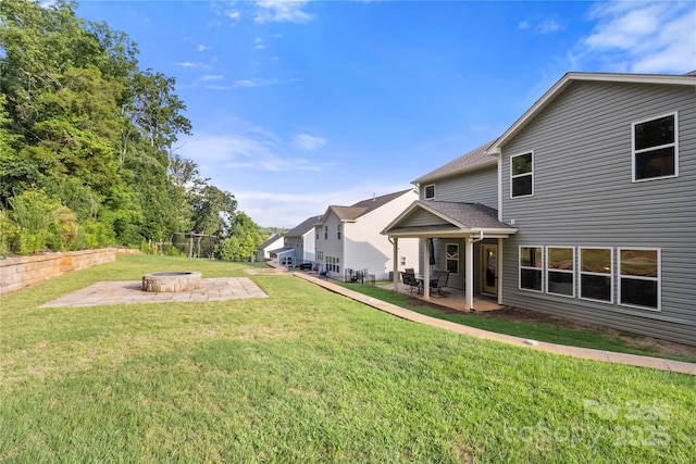 3212 Gilroy Dr, Fort Mill, SC 29707 - view of green lawn featuring a fire pit and a patio area