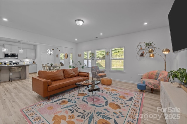 229 Cramerton Mills Parkway, Cramerton, NC 28032 - living area with light wood finished floors, recessed lighting, and baseboards