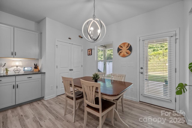 229 Cramerton Mills Parkway, Cramerton, NC 28032 - dining room with light wood-type flooring and a chandelier